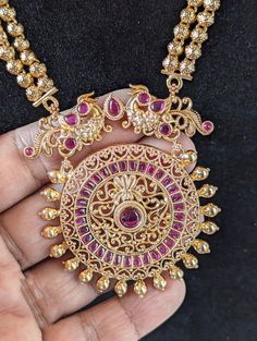 Step into the world of timeless elegance and traditional beauty with this stunning Ruby and gold toned Traditional Indian  Rani Haar necklace set. This long Rani Haar is adorned with intricate Meena Kari work, and it comes with matching earrings for a complete look.  Long Unique Rani Haar Necklace/ Indian Long Necklace / Pakistani Jewelry / Peacock Necklace Mala /Traditional Jewelry/Gold Plated Bridal Necklace PRODUCT VARIATIONS - We strive to present each product with utmost accuracy and detail Gold Plated Round Temple Necklace For Festive Occasions, Festive Gold Plated Round Temple Necklace, Festive Bollywood Jewelry Sets With Peacock Design, Gold Plated Temple Jewelry Sets, Antique Gold Temple Jewelry For Festive Season, Temple Jewelry Sets For Celebration, Antique Gold Jewelry With Intricate Design For Diwali, Gold Plated Jewelry With Intricate Design For Puja, Antique Gold Intricate Jewelry For Diwali