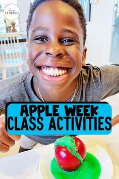 a young boy holding up a sign that says apple week class activities with an apple on the plate