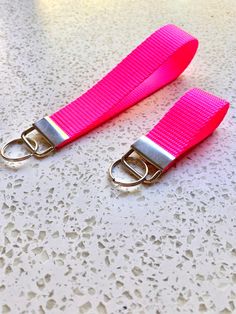 two pink straps are sitting on a table