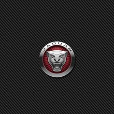 the jaguar logo is shown on a black carbon fiber wallpaper with red and silver accents