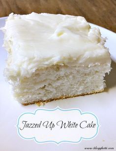 a piece of cake with white frosting on a plate