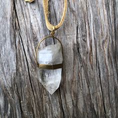 Large natural raw Himalayan crystal quartz point wrapped on  brass pendant on a tan leather lace  Pendant approximate dimensions; L 3"  X W 1.25"  Leather lace is about 36 inches long Bohemian Crystal Necklace With Large Stone, Bohemian Crystal Necklace With Large Adjustable Stone, Brass Pendant, Crystal Quartz, Quartz Points, Leather Lace, Himalayan, Leather And Lace, Le Point