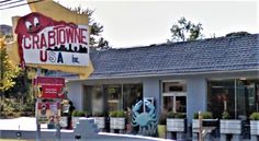 the crabbone restaurant is located on the corner of an intersection in front of a parking lot