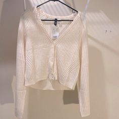 White Cardigan, Size Medium, Never Worn Still Has Tags. H&m White Spring Sweater, H&m White Sweater For Spring, H&m Cotton Sweater For Spring, H&m V-neck Sweater For Spring, H&m Fitted Spring Sweater, H&m Fitted Long Sleeve Cardigan, H&m Fitted Sweater For Spring, Casual H&m V-neck Cardigan, Fitted H&m Sweater For Spring