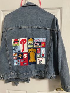 Hand painted Phillies denim jacket. Made to order to allow for design changes and different sizes. Denim jacket style may differ. Message me for any questions! Trendy Cotton Denim Jacket With Custom Artwork, Spring Casual Denim Jacket With Custom Artwork, Casual Spring Denim Jacket With Custom Artwork, Casual Blue Denim Jacket With Custom Artwork, Casual Denim Jacket With Custom Artwork For Fall, Custom Artwork Long Sleeve Cotton Denim Jacket, Casual Cotton Denim Jacket With Custom Artwork, Long Sleeve Cotton Denim Jacket With Custom Artwork, Fall Denim Jacket With Custom Artwork