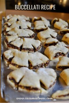 several pastries on a baking sheet ready to be baked in the oven for consumption