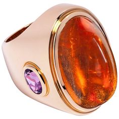 An eye-catching piece. 18 carat rose gold cocktailring. With an unique Mandarine-Garnet 51.21 ct and 2 Amethysts 2.41 ct in all. The Ring has been designed and handcrafted by Colleen B. Rosenblat in our atelier in Hamburg. The Ringsize is EU 56 = US 7.6. Luxury Rose Gold Cabochon Rings, Formal Rose Gold Cabochon Ring, Rose Gold Cocktail, Hermes Kelly Bag, Gold Cocktail Ring, Kelly Bag, Gold Cocktail, Harpers Bazaar, Fashion Sale