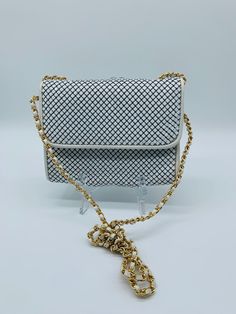 Whiting and Davis chainmail purse. Please note that about 3 of the chainmail pieces are missing or lose at the top edge of the bag under the flap.  Gold tone chain strap with white leather woven through.  Approx 7" x 5" Strap drop 24" Chainmail Bag, Luxury White Wallet On Chain, Elegant Chainmail Bag, Evening Rectangular Chainmail Bag, Silver Metal Chainmail Bag, Leather Weaving, Chain Mail, White Enamel, Chain Strap