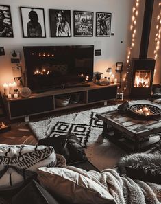 a living room with candles and pictures on the wall