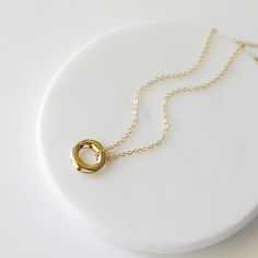 "Beautiful and lovely gold pendant necklace. Made of small gold circle pendant with skinny gold plated brass chain. Soft and warm. Great for gift, everyday or special occasion. Your item will ship in a gift box. Please feel free to contact me if you have any question. ♥ Length 15\" - 20\" ♥ Pendant 5/8\" ♥ Gold plated over brass ♥ See more Rudiana Accessories Rudiana.etsy.com" Simple Gold Necklace For Bridesmaid Gift, Minimalist Gold Charm Necklace For Everyday Wear, Minimalist Gold Charm Necklace For Everyday, Everyday Minimalist Gold Charm Necklace, Gold Charm Necklace With Simple Design For Gift, Minimalist Gold Plated Charm Necklaces, Minimalist Gold Plated Charm Necklace, Simple Gold Charm Necklaces For Bridesmaids, Minimalist Yellow Gold Charm Necklace As Gift For Her