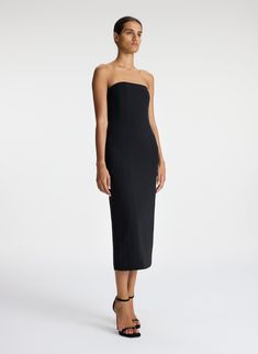 The Elizabeth Dress, a part of A.L.C.'s Signature Collection, is impeccably cut from matte black fabric. This tailored silhouette is strapless, featuring bone corsetry, pockets and darted seams for a feminine fit. Shop Dresses Styling Tip: Lean into '90s minimalism by pairing it with strappy stilettos and a small shoulder bag. Black Strapless Elastane Dress, Sleek Black Strapless Midi Dress, Black Strapless Off-shoulder Stretch Dress, Fitted Black Off-shoulder Midi Dress, Black Dress Midi, Luxury Black Off-shoulder Midi Dress, 90s Minimalism, Strappy Stilettos, Strapless Midi Dress