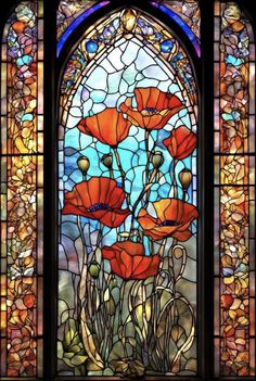 a stained glass window with red flowers in it