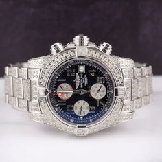 Breitling Avenger ll Chrono 43mm Watch Customized With 12.00 Carats of Genuine Diamonds! The Entire Case, Band Buckle, and Bezel Have Been Beautifully Handset in White "SI" Round Brilliant Cut Diamonds. The Diamonds are G/H in Color. Retail Price After Customization Over $12,000. Size: 43 mm.  Color: Blue.  Gender: male.  Age Group: adult. Luxury Silver Diamond Watch With Tachymeter, Blue Diamond Watch With Round Dial, Luxury Diamond Chronograph Watch For Formal Events, Silver Diamond Watch With Tachymeter, Luxury White Gold Chronograph Jewelry And Watches, White Gold Round Watch With Tachymeter, Silver Diamond Chronometer Watch, Chronograph Round Jewelry And Watches For Anniversary, Silver Diamond Watch With Chronometer