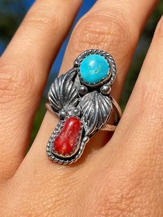 Beautiful southwestern style vintage Turquoise ring that is Native American made Size 5.75 US Comes in recycled and compostable gift box and mailer Vintage Turquoise Coral Southwestern Sterling Ring Southwestern Turquoise Ring Round Shape For Gift, Southwestern Style Turquoise Ring As A Gift, Southwestern Style Turquoise Ring For Gifts, Southwestern Style Round Turquoise Ring For Gift, Untreated Southwestern Turquoise Ring Gift, Southwestern Style Red Turquoise Ring, Vintage Turquoise Ring, Carnelian Ring, Southwestern Style