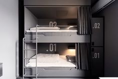 two bunk beds with numbers on them in a room that looks like it has been built into the wall