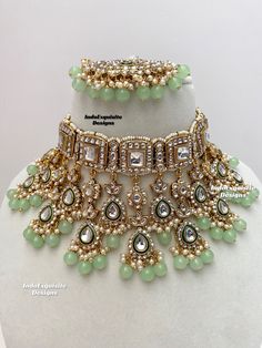 Premium quality elegant Kundan choker comes with Jhumki Earrings and Tikka/ Indian Jewelry/Premium Quality Polki and Kundan Jewelry/mint/sage green/pista All items are shipped from Brampton, Ontario, Canada. If you need your item by a certain day, please reach out to us for express delivery option before placing the order so that we can update the shipping for you. Standard shipping/delivery timeline Below are the delivery timeline estimates. We dispatch all orders by the next business day. ---> Festive Green Choker For Wedding, Green Wedding Choker For Festive Occasions, Pista Green Jewelry For Festive Wedding, Green Bollywood Bridal Sets For Reception, Luxury Pista Green Kundan Sets, Heavy Green Jewelry Sets For Reception, Green Kundan Jewelry Sets For Reception, Heavy Green Kundan Jewelry Sets, Pista Green Jewellery Set