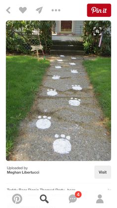 the sidewalk is decorated with white paw prints