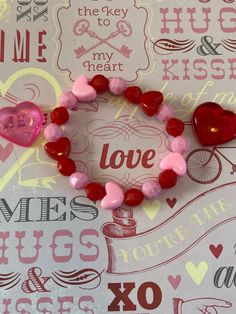 This is a Valentine heart bracelet.  It would make a cute gift for a little girl for Valentines Day. It would make a cute addition to a little girl's Valentine outfit. It has three pink heart pony beads and two red heart pony beads. It has red and pink solid 8mm faceted beads. It was made with .8mm sturdy stretch string. I tie it several times to prevent breakage. It fits girls ages 5-8. It stretches to fit on the wrist. All items are ready to be shipped I do combined shipping. Items ship in 2-5 Girls Valentines Outfit, Gifts For Valentines, Bracelets For Kids, Bracelets For Girls, Valentines Bracelets, Bracelet Heart, Diy Bracelet Designs, Valentines Outfits, Pink Solid