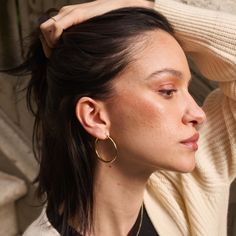 We combined a classic, pared-down aesthetic with 14k solid gold to create our timeless Tube Hoop Earrings. Made with forever in mind, these ultra-lightweight hoops are forged from solid gold (not plated or filled), which means they’ll never tarnish. Wear them all day, every day — they suit any situation. Classic Small Hoop Earrings In 14k Gold Filled, Classic 14k Gold Hoop Earrings For Everyday, Minimalist Yellow Gold Hoop Earrings, Classic 14k Gold Filled Hoop Earrings For Everyday Luxury, Timeless Yellow Gold Hoop Earrings For Everyday, Modern Polished Hoop Earrings For Everyday, Timeless 14k Gold Hypoallergenic Hoop Earrings, 14k Gold Filled Earrings With Polished Finish For Everyday, Classic 14k Gold Filled Tarnish Resistant Hoop Earrings