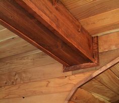 the inside of a cabin with wood paneling