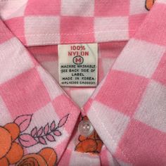 Orange, pink, purple & white blouse in nylon. Has buttons down the front, long sleeves, and pointed collar. Has original attached K Mart tags. Looks like it has never been worn. Detailed Measurements:Bust - 38 inches Waist - 36 inches Shoulder - 15 inches Body Length - 25 inches Sleeve Length - 22 inches Pink Collared Shirt With Buttons, Pink Long Sleeve Blouse With Button Closure, Vintage Pink Button-up Shirt, Vintage Pink Shirt With Buttons, Vintage Pink Shirt With Button Closure, Vintage Pink Buttoned Shirt, Vintage Pink Tops With Button Closure, Pink Long Sleeve Shirt With Buttons, Retro Pink Button-up Top