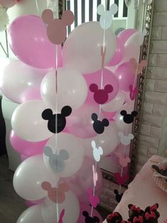 balloons with minnie mouse heads hanging from them