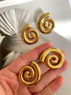 Embrace your inner beauty with our Spiral Statement Earrings. Made with stainless steel and gold plating, these earrings are sure to make a statement and elevate any outfit. Step out in style and let your elegance shine. Carrie Necklace, Trending Earrings, Gold Minimalist Jewelry, Jewelry Product Shots, Jewelry Aesthetic, Find Your Way, Earring Trends, Casual Jewelry, Jewelry Accessories Ideas