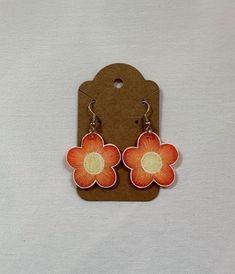 Handmade shrinky dink flower dangle earrings! Orange Flower Earrings For Spring, Cute Flower Shaped Earrings With Ear Wire, Cute Adjustable Flower Charm Earrings, Cute Nickel-free Flower Shaped Earrings, Retro Flower-shaped Earrings For Gift, Orange Flower-shaped Adjustable Earrings, Cute Flower Charm Drop Earrings, Handmade Retro Flower Earrings, Retro Flower Shaped Earrings As Gift