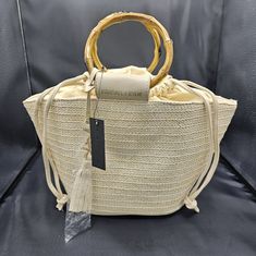 Very Cute Purse Perfect For Vacationing! Kendall & Kylie Spring Cream Bag With Bamboo Handle, Cream Bags With Bamboo Handle For Spring, Summer Straw Bag Adjustable, Spring Beige Straw Bag With Bamboo Handle, Adjustable Straw Bag For Beach In Spring, Adjustable Straw Beach Bag For Spring, Spring Cream Bucket Straw Bag, Spring Adjustable Woven Bags, White Straw Bag With Bamboo Handle For Summer