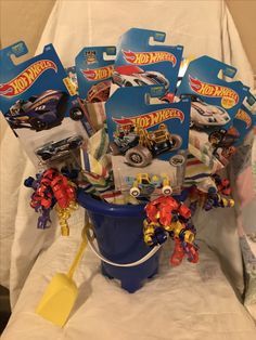 a bucket full of hot wheels and other toys