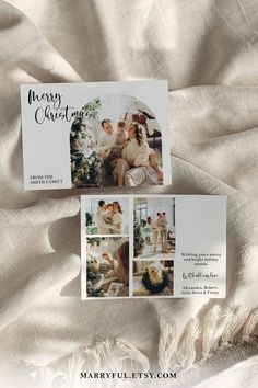 two christmas cards sitting on top of a white blanket