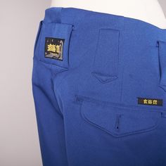 The Pants Are In Deadstock Condition With Tags Still Attached. Royal Shade Of Blue. There Are 2 Hip Pockets, A Small Front Pocket, 2 Button Back Pockets And Side Utility Pocket. Zipper At The Ankles Which Allows The Pants To Hang Over And Give A Wide Baggy Look. Measures 38 Cm Across Waist, 30 Cm Rise, 114 Cm Inseam Fitted Blue Bottoms With Hip Pockets, Fitted Blue Bottoms For Streetwear, Fitted Blue Pants With Hip Pockets, Blue Tapered Leg Pants With Side Pockets, Blue Pants With Belt Loops For Streetwear, Blue Streetwear Pants With Hip Pockets, Fitted Blue Straight Leg Cargo Pants, Blue Pants With Hip Pockets For Streetwear, Fitted Blue Pants For Streetwear