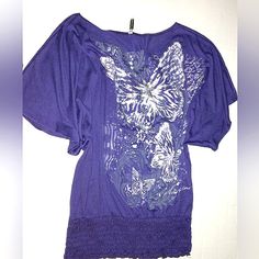 New With Tags Plus Size 1x Beautiful Flutter Sleeve Top With Thick Super Stretchy Elastic Panel Bottom Which Sits Typically Below Waist & Above The Hips Top Has Unique Large Flowing Flutter Sleeves That Look Fabulous While On. Large Butterfly Graphics On Front. Graphic Is Mixture Of Light Purple, White & Dark Gray. The Butterflies Are Done In Pretty Metallic Silver. Behind The Butterflies There Is Paisley Prints & Looks Like Zebra Stripes As Well. Around The Butterfly Scene There Is Also Cursive Silver Stretch Top For Spring, Dressy Tops, Silver Stretch Tops For Spring, Casual Silver Tops For Spring, Metallic Butterfly, Butterfly Blouse, Zebra Stripes, Flutter Sleeve Top, Royal Purple