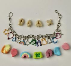 a bracelet with charms and letters on it