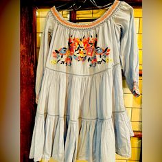 This Beautiful Free People 'Sunbeam' Mini Dress Features A Blue Floral Pattern With Embroidered Accents. The Off-The-Shoulder Neckline And 3/4 Sleeves Add A Touch Of Elegance To This Casual, Yet Stylish Dress. It's Perfect For Any Occasion, Whether You're Going To A Travel Destination, A Party, Or Just A Casual Outing. Made With A Combination Of Rayon And Cotton Materials, This Dress Is Comfortable And Lightweight, Making It Perfect For Summer, Fall, And Spring Seasons. The Pullover Closure And Casual Boho Dress With Floral Embroidery For Spring, Fall Beach Embroidered Dress, Summer Long Sleeve Boho Dress With Embroidered Hem, Long Sleeve Boho Dress With Embroidered Hem For Summer, Casual Boho Dress With Embroidered Hem For Summer, Fitted Boho Dress With Floral Embroidery For Spring, Bohemian Dress With Embroidered Hem For Brunch, Casual Long Sleeve Embroidered Dress For Festival, Blue Embroidered Dress For Fall