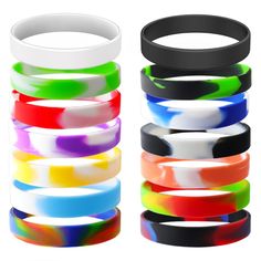 several different colored bracelets stacked on top of each other