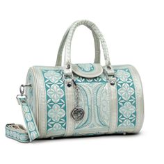 Our stunning cross-body bag is ready to have you turning heads. The intricate embroidery, featuring traditional Indonesian designs lends to its beauty, while its generous size makes for a gorgeous everyday handbag. The Barrel Bag is not only beautiful, but it's 100% cruelty-free. Whether you are vegan or looking for ethical and artisanal-made, the Barrel Bag is a top choice for the conscious consumer.    * Snap button closure on the exterior front.  * Three pockets including one zippered in the cotton-lined interior.   * Comfortable, detachable and adjustable body strap included.   Ethically Handcrafted in Sumatra, Indonesia. Luxury Embroidered Travel Bags, Luxury Hand Tooled Satchel For Travel, Luxury Hand-tooled Satchel For Travel, Luxury Hand-tooled Travel Satchel, Hand-tooled Travel Bag With Double Handles, Hand Tooled Double Handle Travel Bag, Luxury Hand Tooled Crossbody Bag, Hand Tooled Crossbody Satchel For Travel, Top Handle Embroidered Satchel For Travel