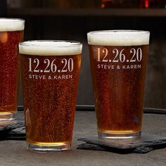 three beer glasses sitting on top of a table next to each other, with the words your text here up to 4 lines choose from 7 font options