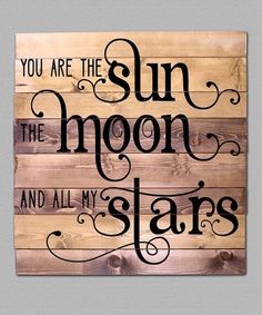 a wooden sign that says you are the sun, the moon and all my stars