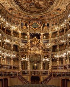 an ornately decorated auditorium with chandeliers