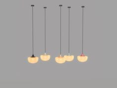 five lights hanging from the ceiling in different shapes and sizes, with one light on each side