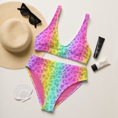 This 90s neon animal print inspired rainbow cheetah print bikini is perfect for the beach, a pride festival, 90s, Y2K, or bachelorette party. This high-waisted swimsuit features a flattering fit, and the bright colors will make you stand out from the rest. Combine two trends in one (while supporting a recycled product)! * 88% Recycled Plastic *Produced sustainably * Double-layered and non-reversible * Removable padding * Tear-away care label * LGBTQ+ woman owned shop Rave Multicolor Swimwear For Vacation, Rave Multicolor Swimwear For Swimming, Multicolor Rave Swimwear For Swimming, Multicolor Rave Swimwear For Vacation, Rave Style Multicolor Swimwear For Swimming, Multicolor Rave Swimwear, Rave Style Multicolor Swimwear For Vacation, Rave Multicolor Swimwear For Beach Season, Fitted Swimwear For Pride Beach Events