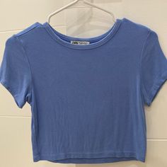 Light Flow Material Baby Blue Round Neck Top Zara Youth Girls Large Never Used Perfect Condition Cute Fitted Blue T-shirt, Light Blue Plain Tops For Spring, Plain Light Blue Tops For Spring, Basic Blue Summer Tops, Plain Blue T-shirt For Spring, Basic Blue Plain Tops, Basic Blue Tops For Summer, Basic Plain Blue Tops, Cute Blue Tops For Spring