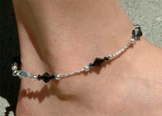 This is a new handmade ankle bracelet made of 100% 1st quality Swarovski crystals. SIMPLE BUT ELEGANTPERFECT GIFT \/WEDDING GIFT FOR BRIDE \/ BRIDESMAID \/ LADY!This anklet is made of 4mm Swarovski diamond shape Jet Hematite 2X crystals, 7mm Jet Black Swarovski crystals, 4mm sterling silver ball and twisted sterling silver tube in between for extra sparkle. It ends with a sterling silver lobster clasp.   The anklet measures 9 3\/16" long (23.50cm)  {I can make it 10" \/ size 10 for US$2.00 more} Elegant Crystal Anklets For Gifts, Handmade Ankle Bracelets, Wedding Gift For Bride, Silver Anklet, Simple Gift, Sterling Silver Anklet, Wedding Gifts For Bride, Wedding Bridal Jewellery, Silver Anklets