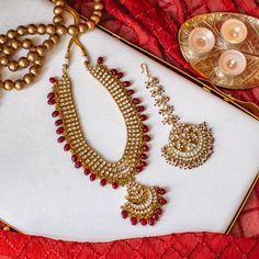 Perfect choice for the wedding events, our Sabira Mala is impeccably designed with enticing details! Exuding brilliance, this mala is encrusted with glittering kundan stones and ruby bead drops. Approximate mala length is 10". Gold-plated on high-quality brass as base metal. Made by order. Kindly allow 5-7 weeks for the delivery of this item. For custom or urgent requests, please contact support@alacouture.com. *Please Note: We use faux stones and beads in all of our jewelry. Ruby Beads, Faux Stone, Waist Chain, Head Accessories, Gift Card Shop, Base Metal, Ring Gift, Wedding Events, Anklets