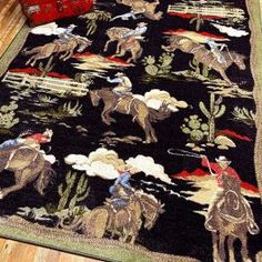 an area rug with horses and cactus on it