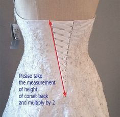 the back of a wedding dress with measurements