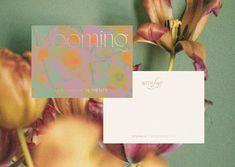 an image of some flowers with a card in front of it that says blooming