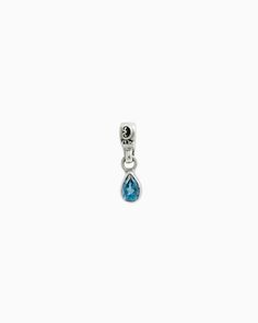 The Teardrop Stone Charm features a faceted pear-shaped blue zircon stone on a petroglyph accented loop. Pair with your favorite hook bracelet or dainty chain, sold separately. Metal: Sterling silver Stone: Blue zircon Dimensions: 16mm x 4mm Stone Size: 6mm x 4mm Style #: C120BZ Sterling Silver Drop Jewelry With Dangling Charms, Faceted Teardrop Sapphire Jewelry, Teardrop Sapphire Faceted Jewelry, Sterling Silver Teardrop Charms Jewelry, Everyday Teardrop Charm Jewelry, Everyday Teardrop Charms Jewelry, Teardrop Sapphire Birthstone Jewelry, Silver Teardrop Jewelry With Dangling Charms, Teardrop Sapphire Sterling Silver Jewelry