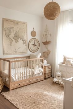 a baby's room with a crib, dresser and map on the wall